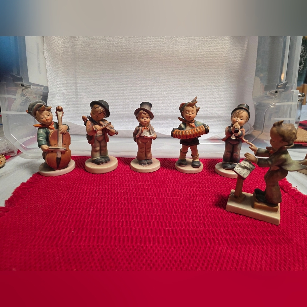 original German Hummels. singer figurine has a broken music sheet as shown.